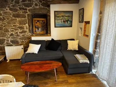 a living room with a couch and a table at Lagar de Guxeva in Chantada