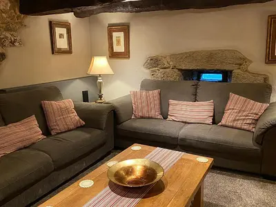 a living room with a couch and a table at Casa Camino Turismo Rural in Palas de Rei