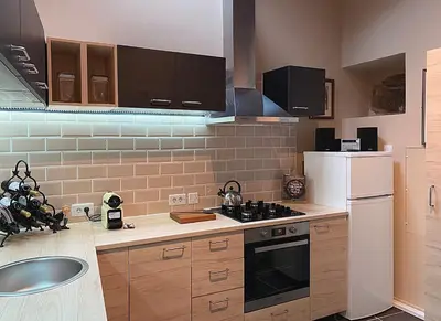 a kitchen with a sink and a white refrigerator at Casa Camino Turismo Rural in Palas de Rei