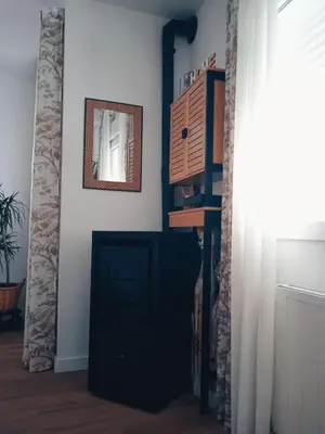 a room with a black door and a mirror at Mi Camino in Sarria