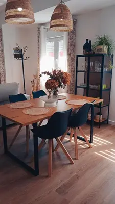 a dining room table and chairs in a living room at Mi Camino in Sarria