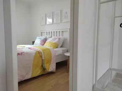 a bedroom with a bed with yellow and white sheets at Casa da Porta -----------------3 dormitorios in Lugo