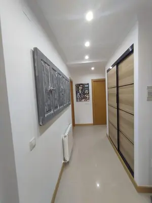 a hallway with a room with a door and a radiator at Casa da Porta -----------------3 dormitorios in Lugo