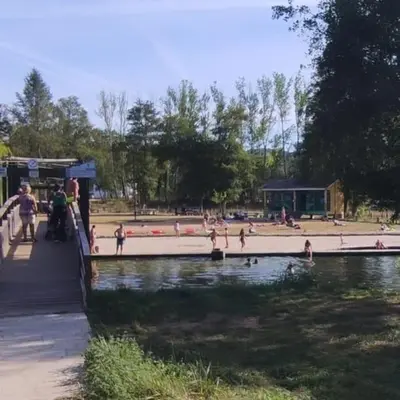 a group of people in the water at a park at Casa Da Praia in Lugo