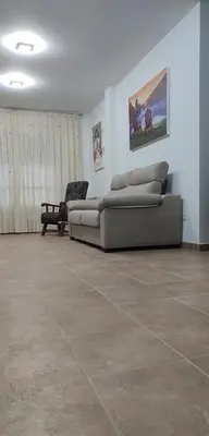 a living room with two couches and a couch at Casa Da Praia in Lugo
