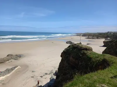 a view of a beach from a cliff at Casa Acantilado Barreiros in Barreiros
