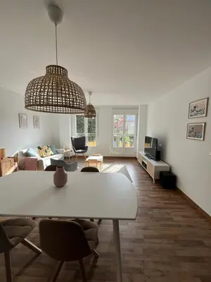 a living room with a table and a couch at EnVIVEIRO Relax Total Playa de Covas in Viveiro