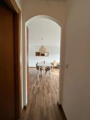 a hallway with a table and a dining room at EnVIVEIRO Relax Total Playa de Covas in Viveiro