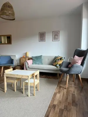 a living room with a couch and a coffee table at EnVIVEIRO Relax Total Playa de Covas in Viveiro