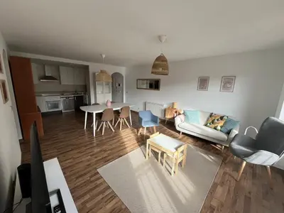 a living room with a couch and a table at EnVIVEIRO Relax Total Playa de Covas in Viveiro