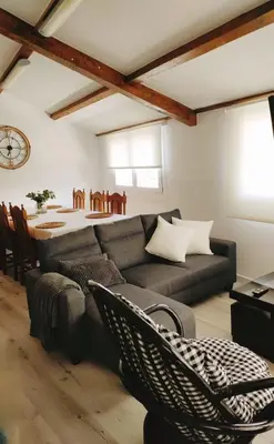 a living room with a couch and a table at Apartamento Llave del Mar in Burela de Cabo