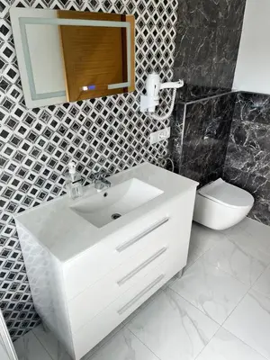 a bathroom with a white sink and a toilet at A de Carmiña in A Coruña
