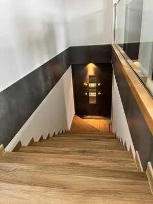 a staircase in a building with wooden floors at A de Carmiña in A Coruña