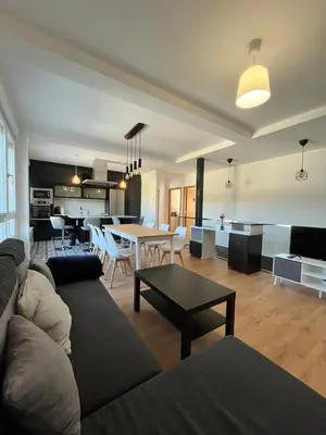 a living room with a couch and a table at A de Carmiña in A Coruña