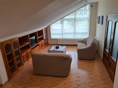 a living room with two chairs and a coffee table at Grenxo in Santiago de Compostela