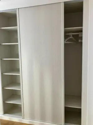 a walk in closet with white doors and shelves at Viveiro Dreams in Viveiro