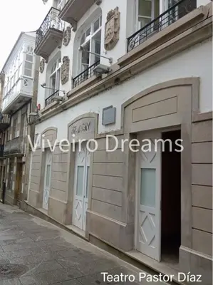 a building on the side of a street at Viveiro Dreams in Viveiro