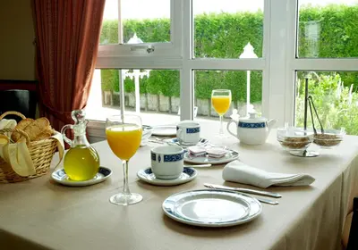 a table with glasses of orange juice and drinks on it at Hotel Castro in Santiago de Compostela