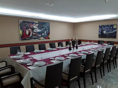 a long long table in a room with chairs at Hotel Castro in Santiago de Compostela