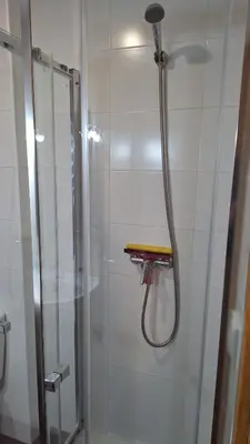 a shower with a glass door in a bathroom at Apartamento con vistas Barreiros in Barreiros