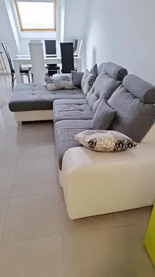 a living room with a couch and a table at Apartamento con vistas Barreiros in Barreiros