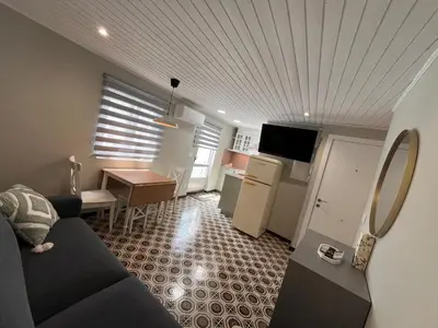a small living room with a couch and a table at Valdeflores flats in Viveiro