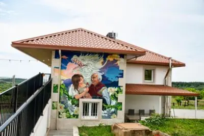 a mural on the side of a house at Pepiño de Tomonte in Atrave