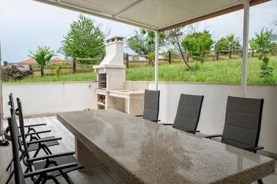 a large concrete table and chairs on a patio at Esperanza de a Trabe in Atrave