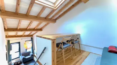 a room with a loft bed and blue ceilings at The Cliffs - Casa Catuxa in Viveiro