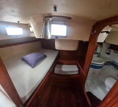 a small bed in the back of a boat at Velero Clásico de madera in Sada
