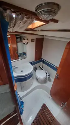 a bathroom with a toilet and a tub and a sink at Velero Clásico de madera in Sada