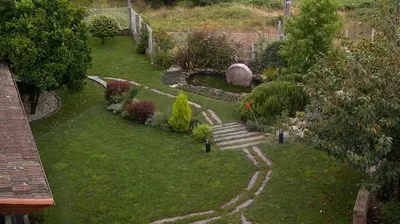 a garden with a staircase in the grass at Casa San Amaro in San Amaro