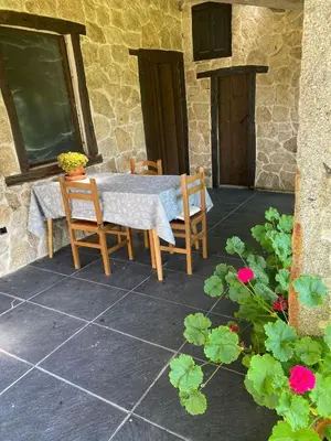 a table and chairs sitting on a patio at Casa San Amaro in San Amaro