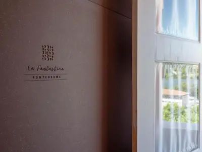 a door with a sign on it next to a window at La Fantástica Pontedeume 3 in Puentedeume