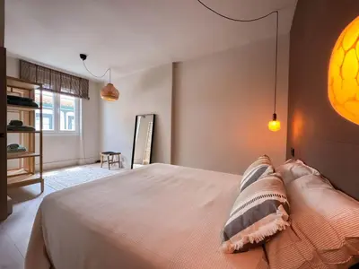a bedroom with a large bed with two pillows at La Fantástica Pontedeume 3 in Puentedeume