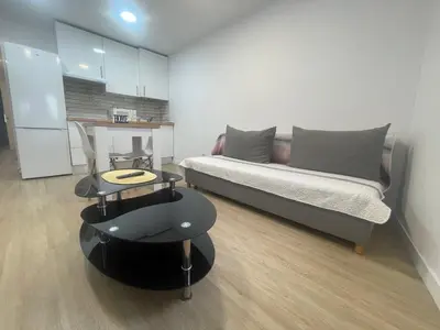a living room with a couch and a table at Céntrico apartamento muralla 1 in Lugo