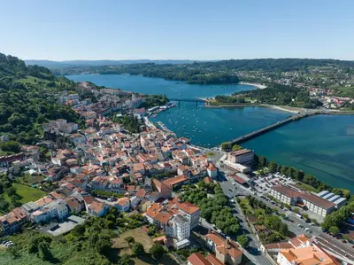 an aerial view of a city and a river at La Fantástica Pontedeume 4 in Puentedeume