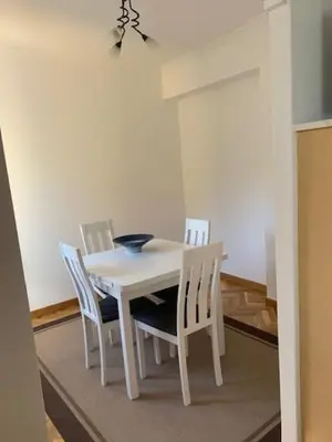 a white table with chairs and a bowl on it at Piso Miño con vistas in Miño