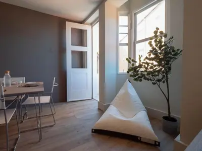 a living room with a table and a plant at La Fantástica Pontedeume 2 in Puentedeume