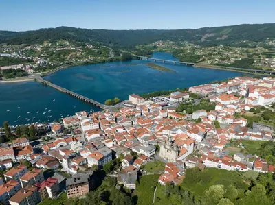 an aerial view of a town on the water at La Fantástica Pontedeume 2 in Puentedeume