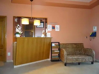 a waiting room with a chair and a counter at Hotel Akelarre in Santiago de Compostela