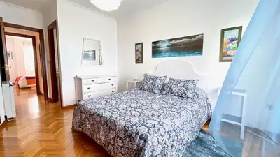 a bedroom with a bed and a dresser at The Cliffs - Brisa Marina in Viveiro