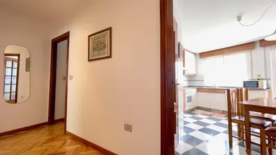 a kitchen and a dining room with a table at The Cliffs - Brisa Marina in Viveiro