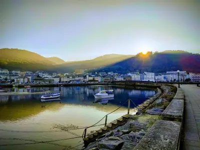 a city with boats in a body of water at The Cliffs - Brisa Marina in Viveiro