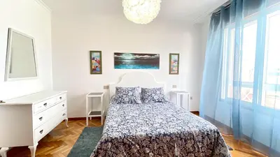 a bedroom with a bed and a dresser and a window at The Cliffs - Brisa Marina in Viveiro