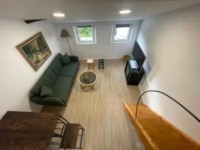 an overhead view of a living room with a couch and a table at Céntrico estudio muralla romana in Lugo