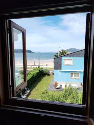 a view of the beach from a window at Covas Beach Ocean in Covas