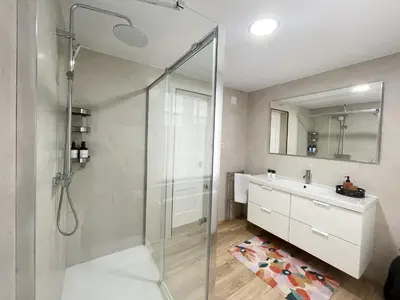a bathroom with a shower and a sink at A Finca Da Toñita in Ribadavia
