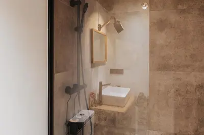 a bathroom with a sink and a shower at Casa do Corral in Hospital