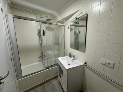 a bathroom with a shower and a sink and a mirror at Oktheway Caldas Centro in Caldas de Reis